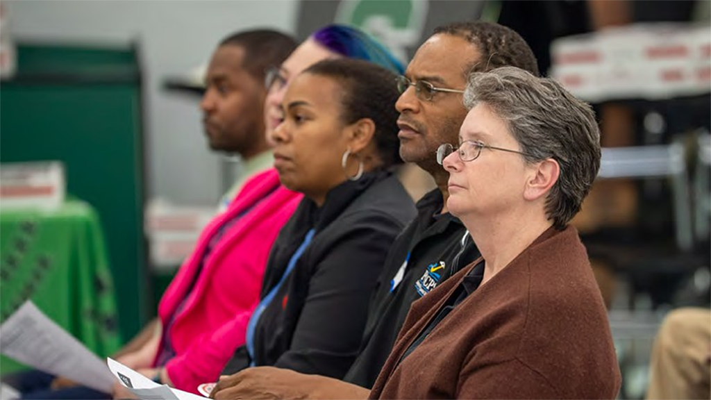 adults-listening-at-meeting
