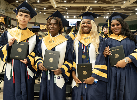 Potomac HS Graduates Holding Diplomas