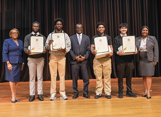 students with engineering scholarship awards certificates