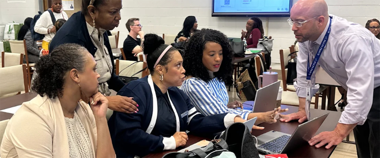 staff-reviewing-data on laptops