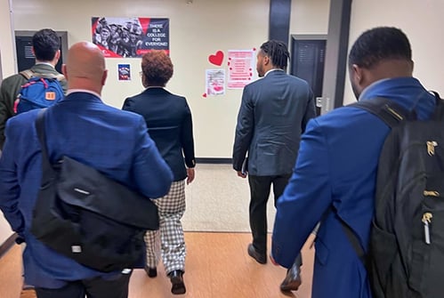 M-PGCPS-and-HGSE-leaders-walking-through-school.jpg