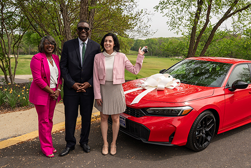 Clara-Allsup-teacher-of-year-with-car-Dr-Joseph