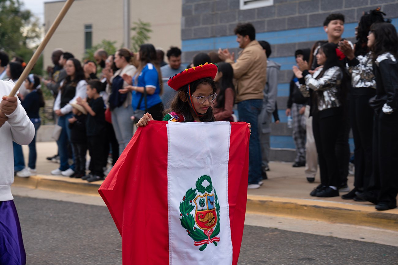 student-in-parade-holding-flag-of-Peru