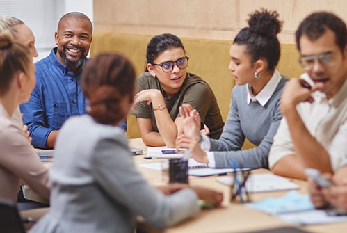 group-of-adults-talking-at-meeting