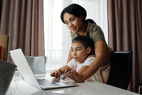 parent-with-child-distance-learning.jpg