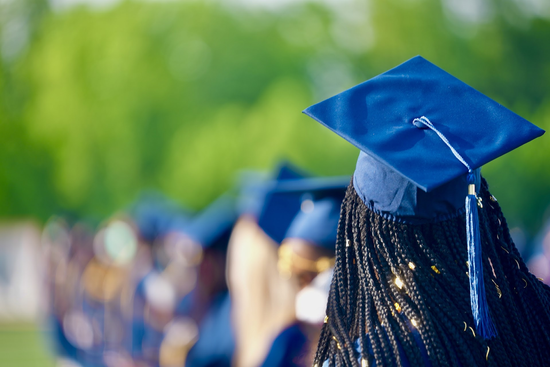 Graduate with cap facing away