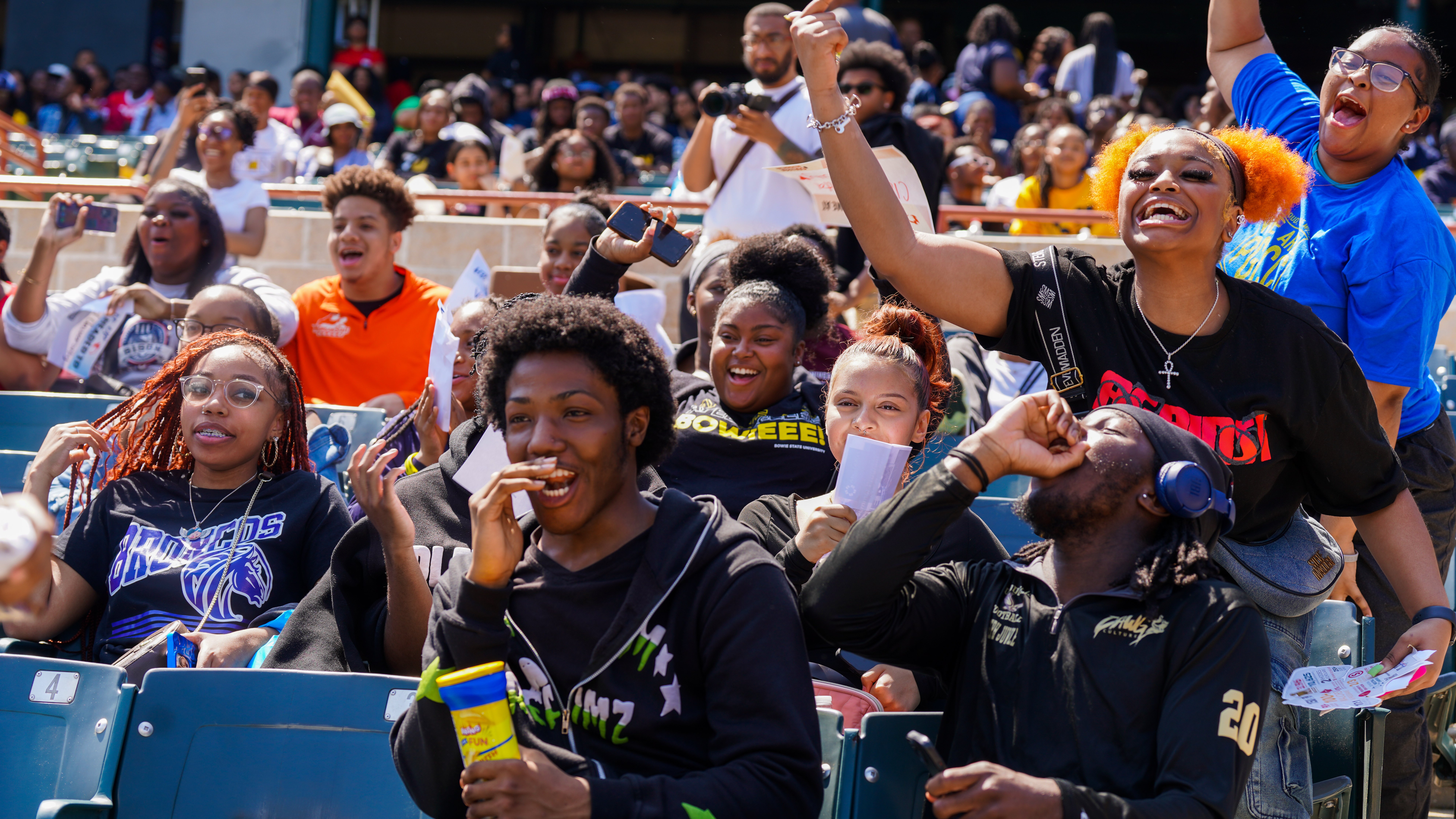 Students Cheering With College Gear.jpg