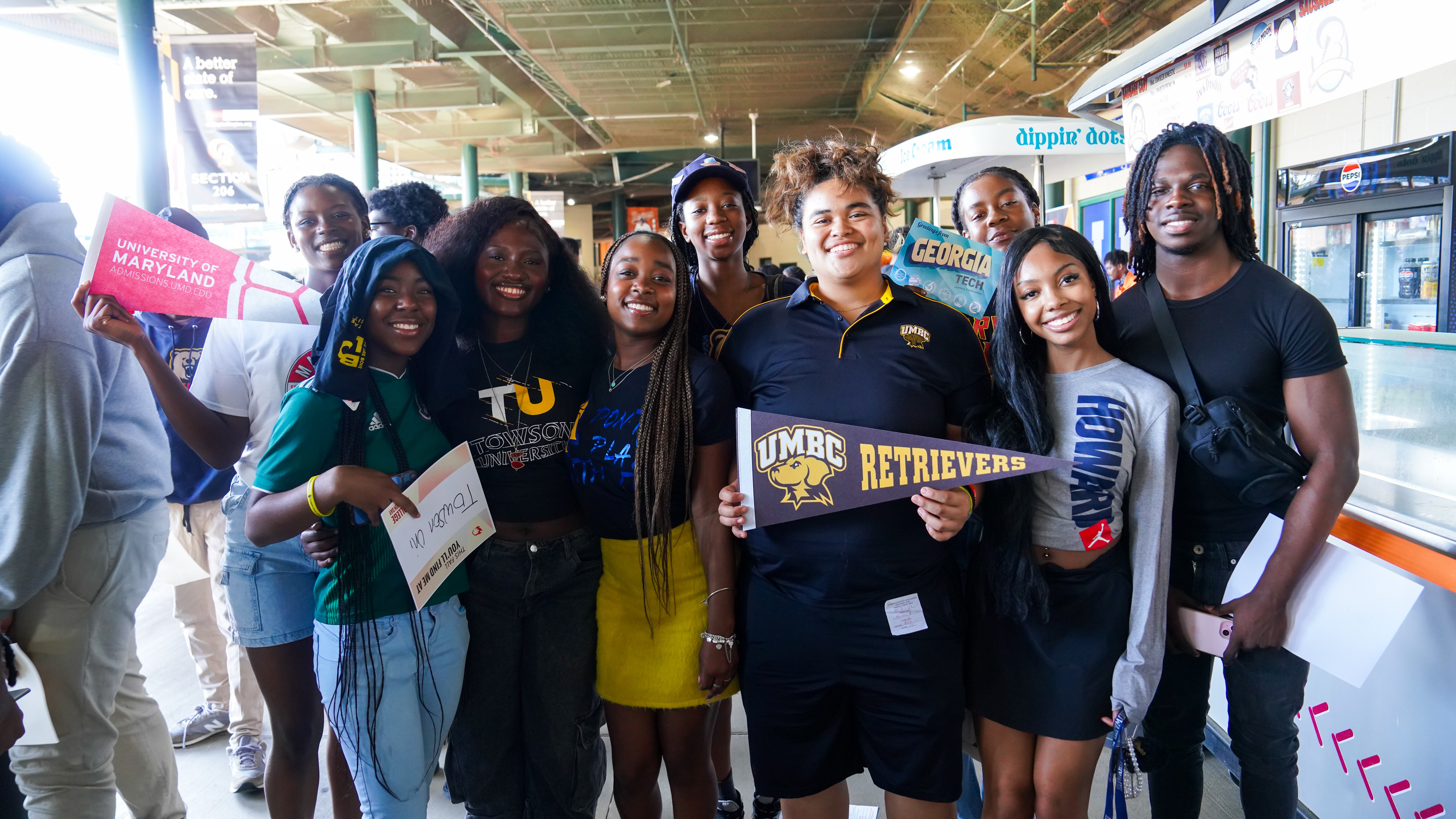 Students Holding Up College Signs.jpg