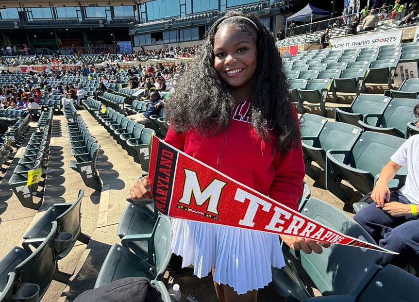 graduate-holding-University-of-Maryland-Terrapins-pennant