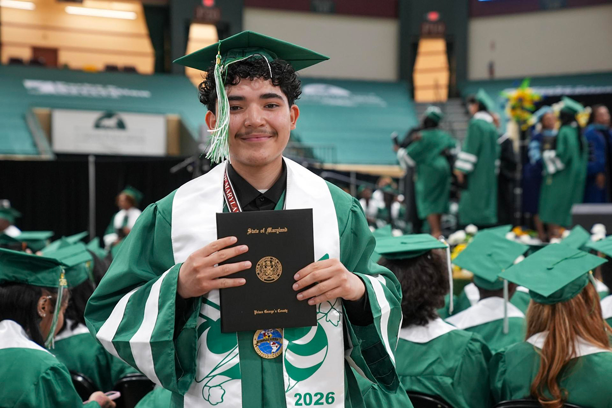 Surrattsville-graduate-holding-diploma