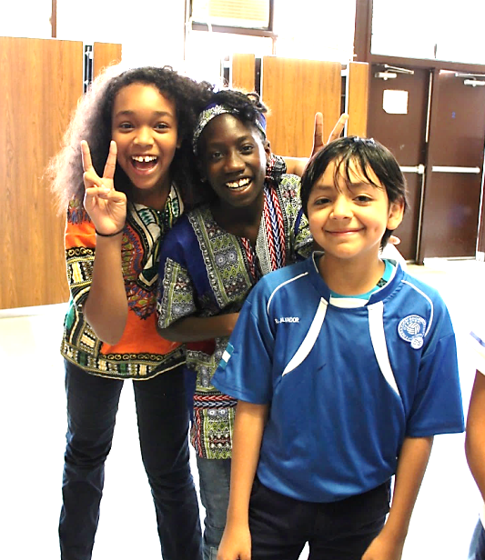 CES-students-in-group-smiling-giving-peace-sign.png