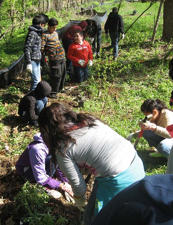 science-students-planting-seedlings-outside.jpg