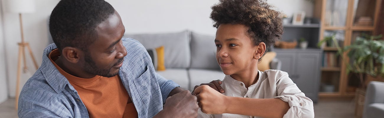 Adult and child celebrating homework