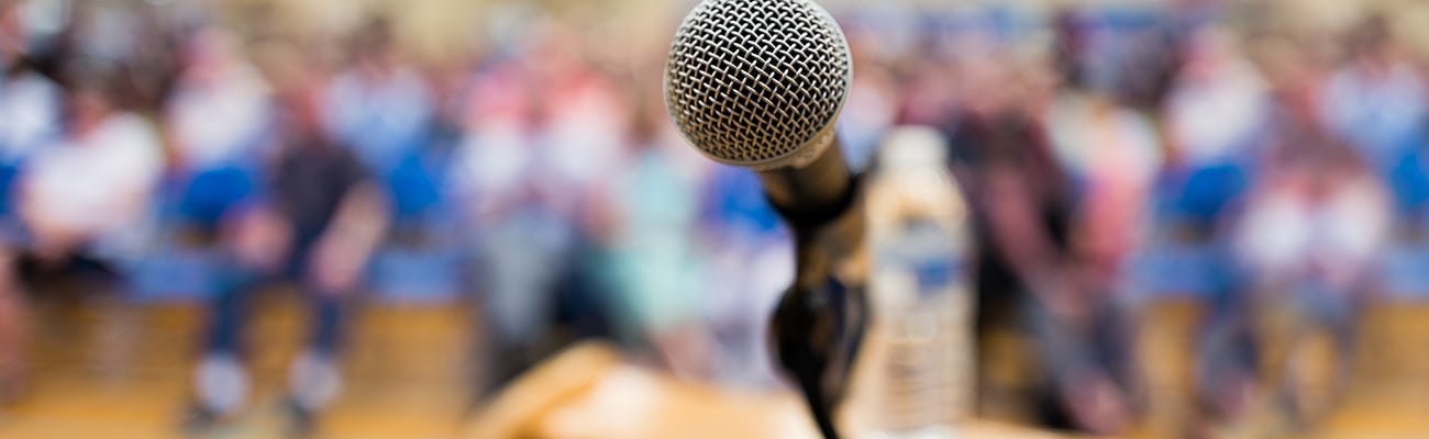 Microphone on stand with audience